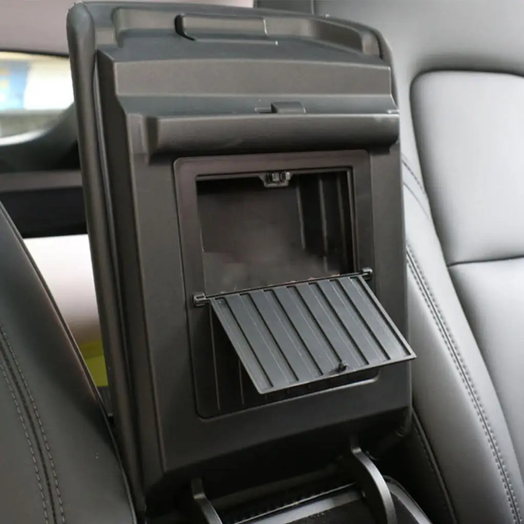 تضيف ملحقات صندوق تخزين مخفي بمسند ذراع وحدة التحكم المركزية من النوع الدفع إلى حجرة صغيرة لتخزين الأشياء الثمينة.