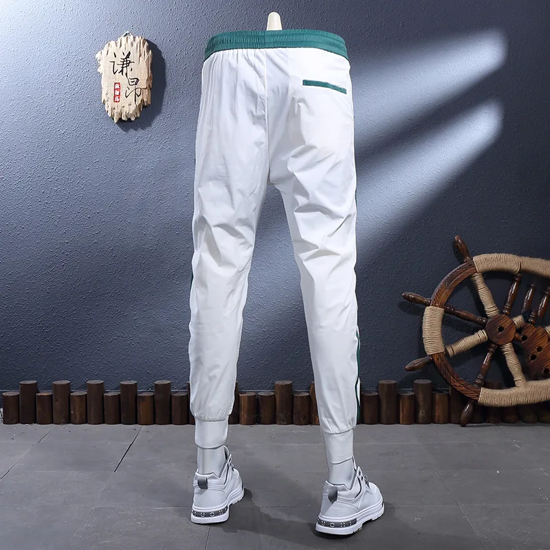 

Summer new thin white breathable elastic slim fit ankle binding casual pants for men, fashionable light luxury sports pants