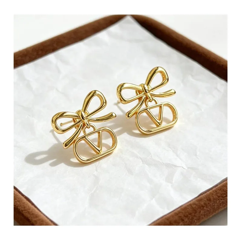 

Golden Bow Hollow Stud Earrings Women's Niche Design Sense Light Luxury High Sense Earrings Needle Versatile Temperament