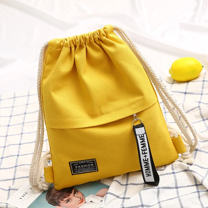 Teenage girls solid color simple canvas drawstring models shoulder bag bundle pocket Korean version convenient backpack female