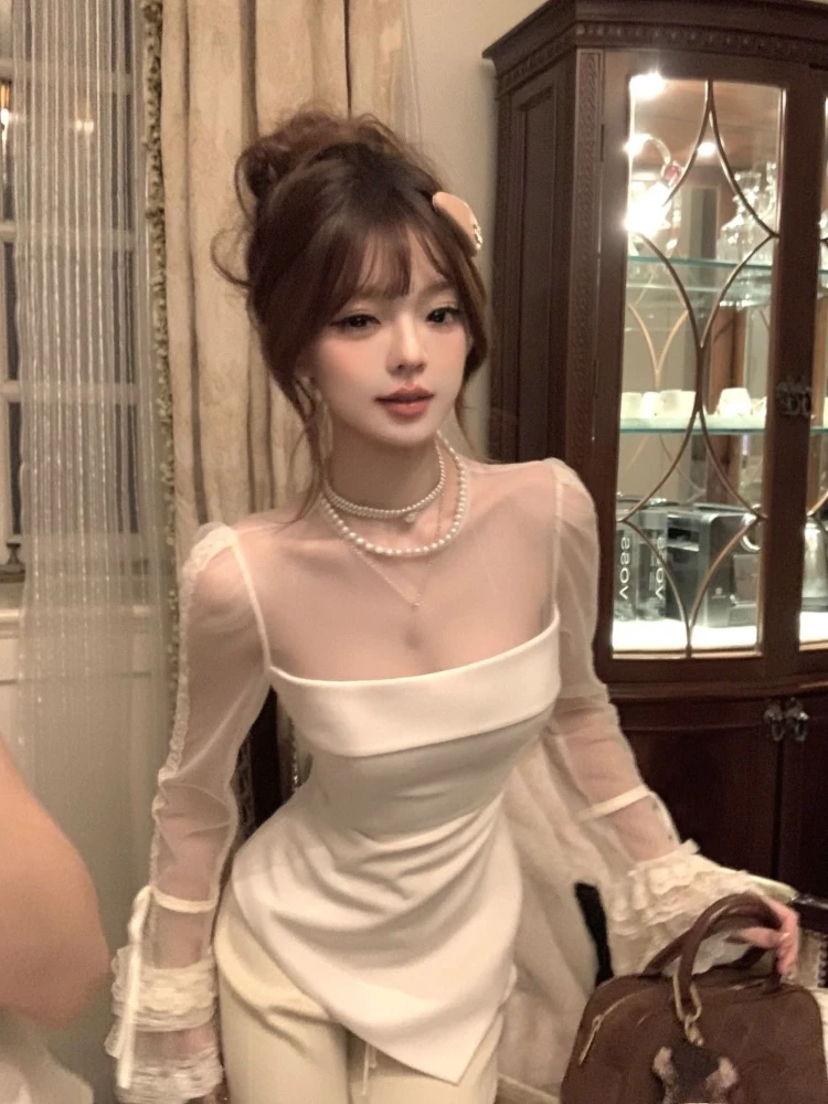 Inverno Nuovo Design Vedere Attraverso Maglia Nera T-shirt a maniche lunghe Donna Y2k Irregolare Slim Fit Magliette e camicette Francese Dolce Elegante Chic Abiti