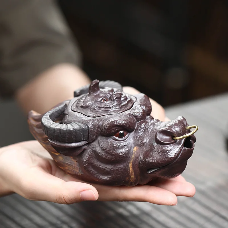 Yixing purple sand raw ore handmade cow fair cup tea pet ornament cow head hand grab pot fair cup bubble teapot gift