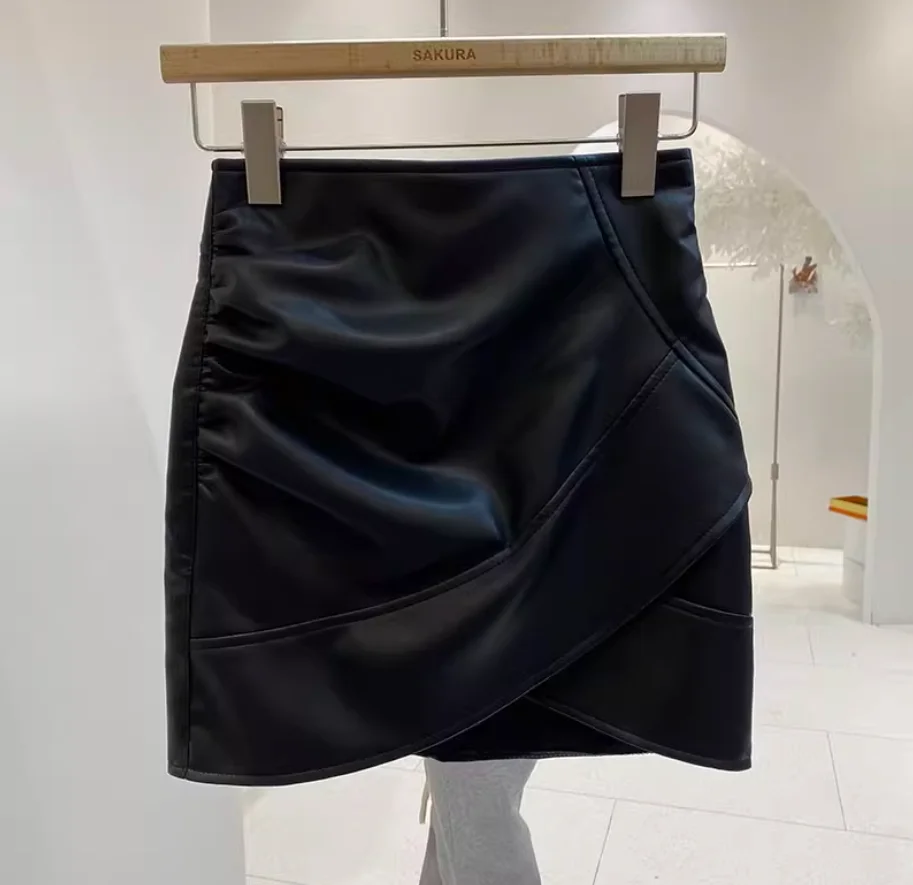 Nueva moda Otoño/Invierno Sexy cintura alta PU Color sólido Slim Fit cintura elástica por encima de la rodilla Mini falda para mujer, 3 colores