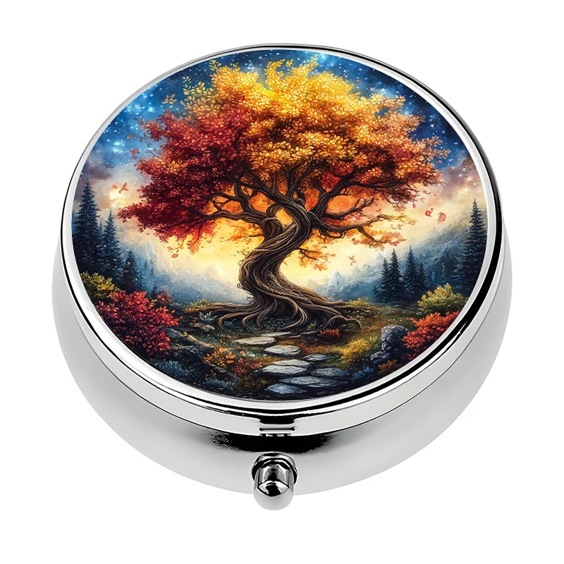 A mini pill box, single compartment, divided into three sections, designed with an autumn tree pattern. This travel-friendly sized pill box is made of metal and is perfect for storing vitamins. It is an ideal gift for those who need a stylish way to express themselves.