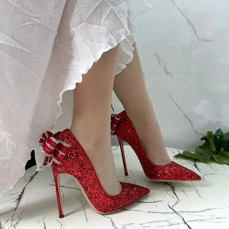 2023 New Designer Bling Red Glitter Butterfly Knot On Back Pointed Toe 12cm High Thin Heel Pump Evening Dress Shoes On Sale