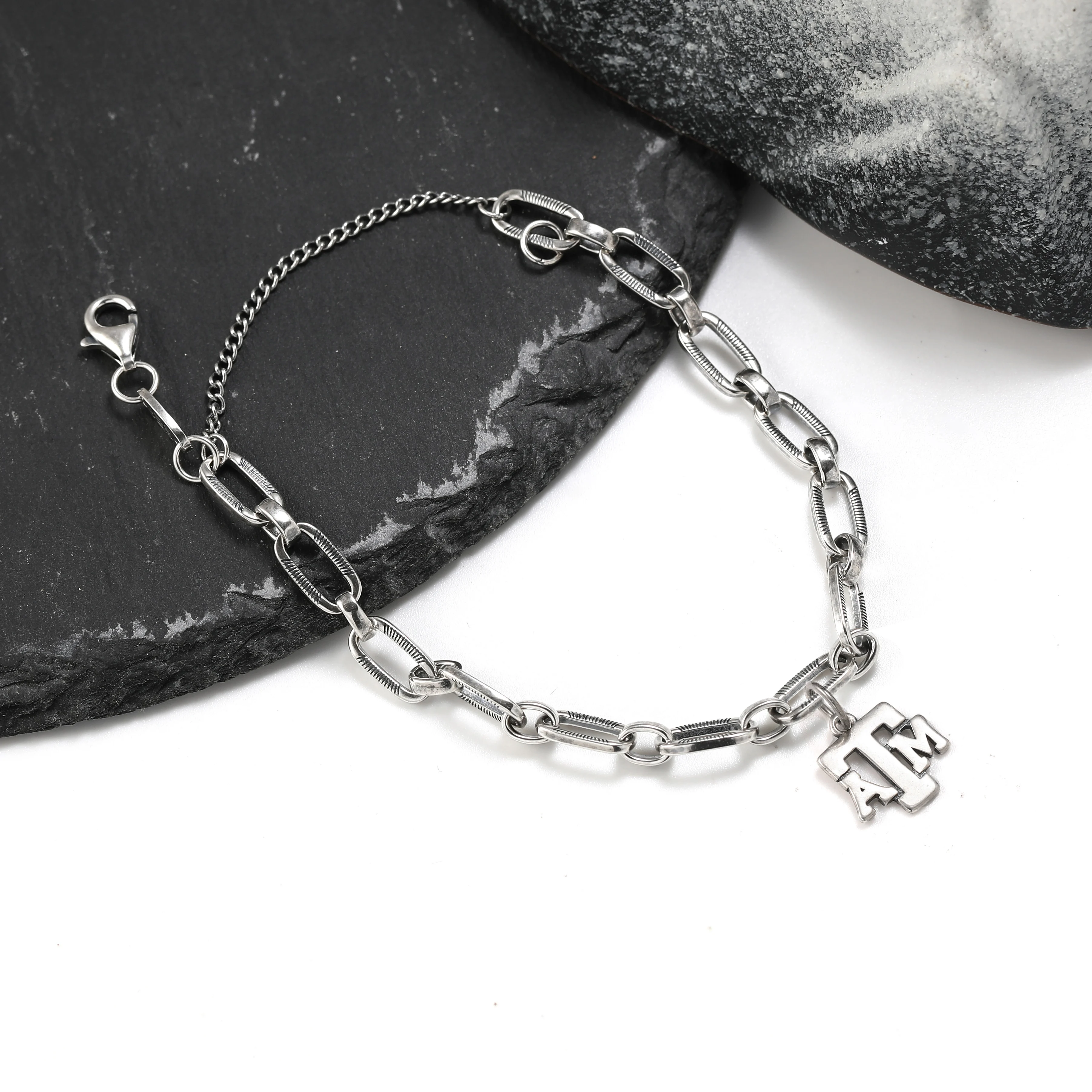 

Authentic 925 sterling silver James Avery Ornate Links Charm Bracelet paired with Texas A&M University pendant