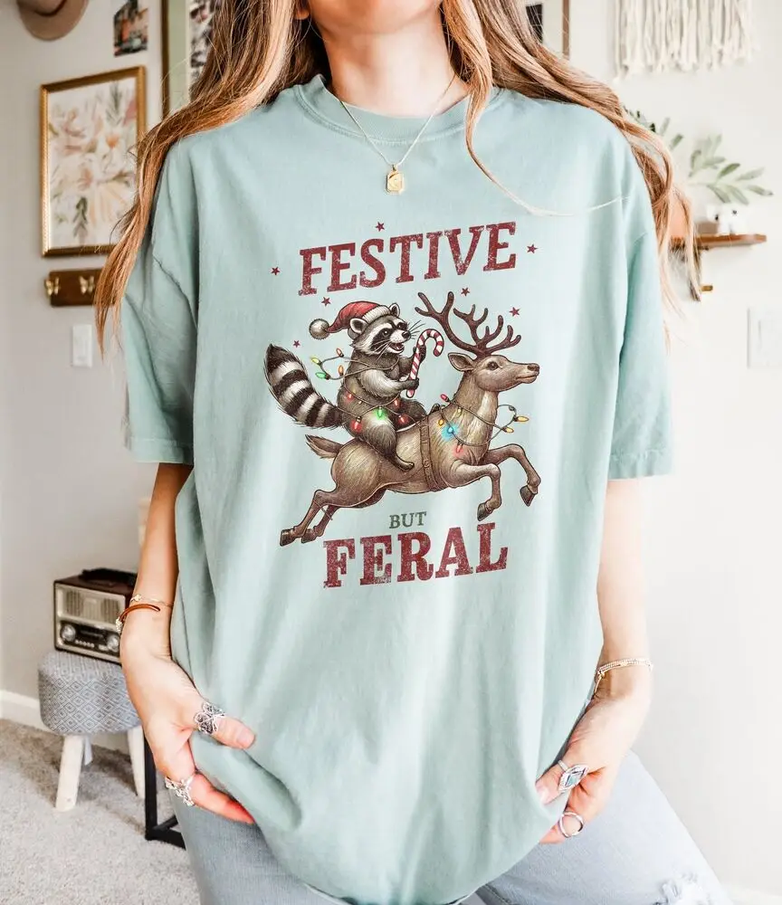 Funny Christmas T-Shirt Featuring Raccoon Riding Reindeer, Unique Holiday Gift