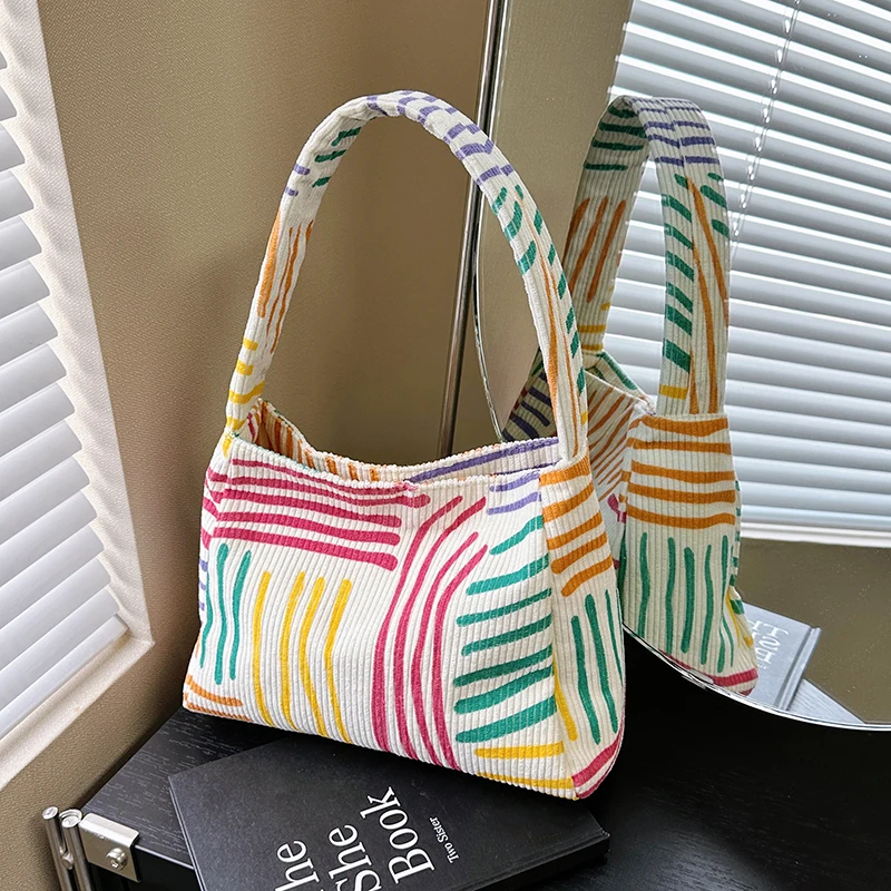 

Hand-carried Rainbow Woven Bucket Bag 2025 New Ins Fashion Fashion Personalized Versatile Clutch Bag Commuting and Leisure