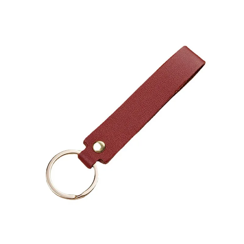 Versatile Solid Leather Key Buckle Handle rope bag Pendant Doll Portable strap Fashionable Couple car Keychain Accessories