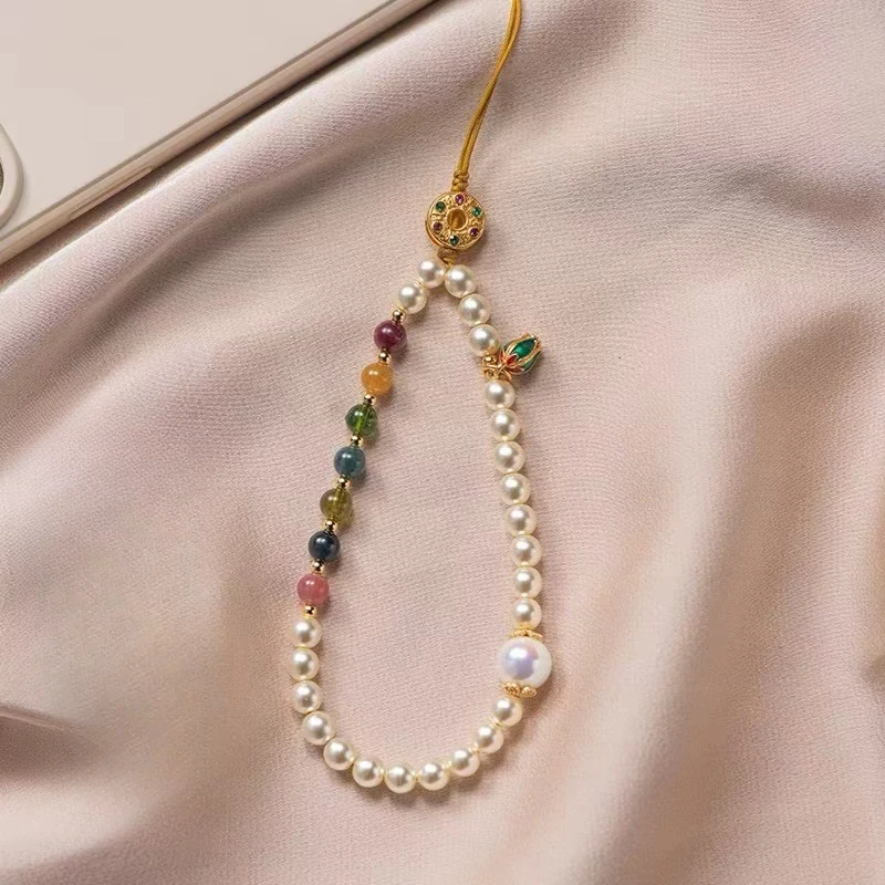 

Temperament pearl mobile phone anti-loss lanyard wrist senior sense girl mobile phone lotus hanging ornaments