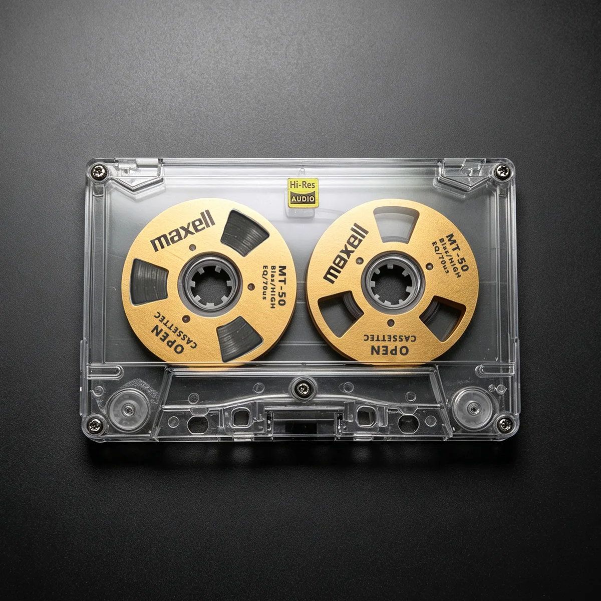 Do kasety Maxell C50 w stylu retro, pustej, dwustronnej, otwartej, z metalowymi rolkami, do nagrywania dźwięku.
