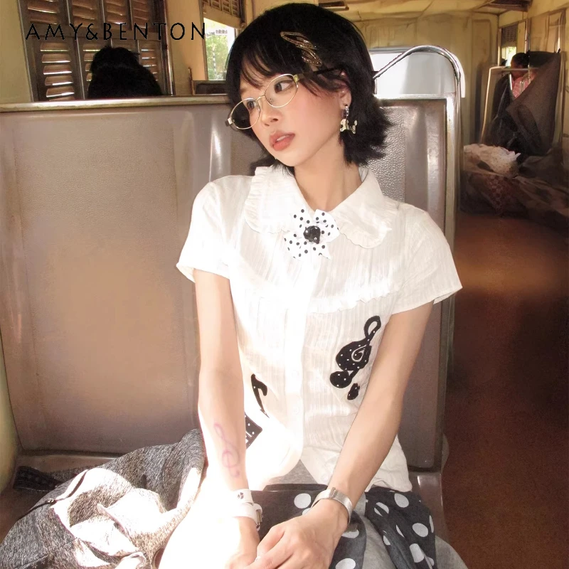 

Женская укороченная рубашка с вышивкой в корейском стиле, с воротником-куклой и музыкальными нотами, новинка 2026 года, белая, приталенная, тонкая, омолаживающая, для женщин