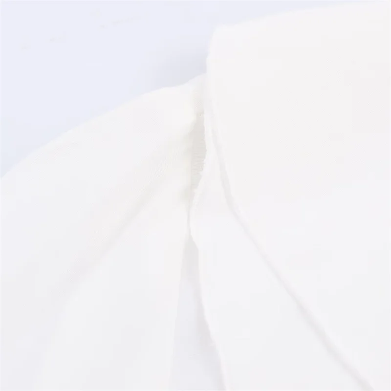 Tendência da moda feminina outono 2025: camisa decorativa em camadas com laço de bloqueio de cores