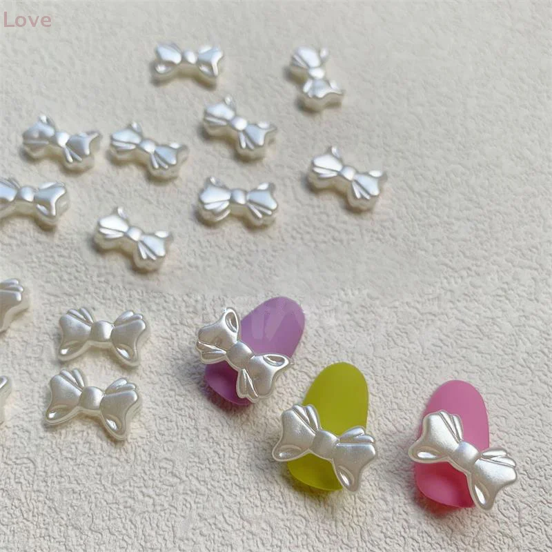 20 قطعة/الحقيبة اللؤلؤ الأبيض الرجعية الفرنسية بسيطة Bowknot مسمار الفن اكسسوارات أنيقة لطيف Bowknot ثلاثية الأبعاد الراتنج لتقوم بها بنفسك مسمار الفن اكسسوارات