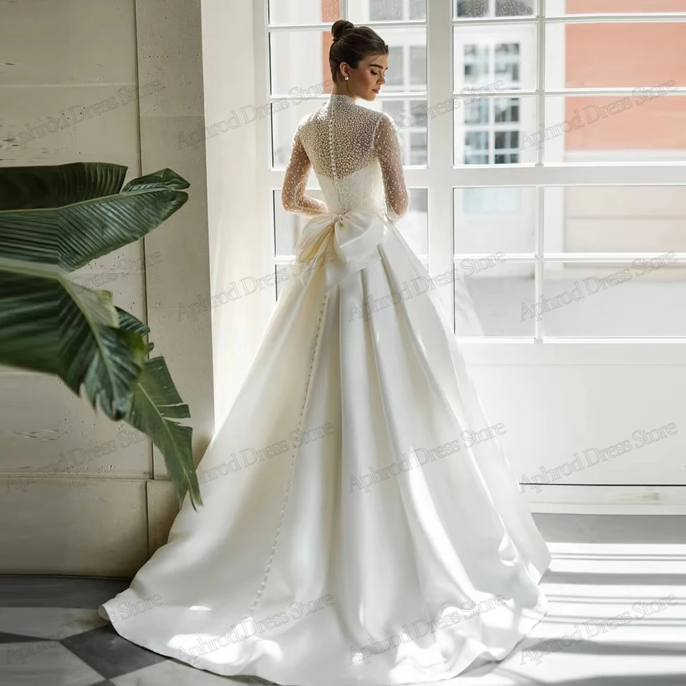 ชุดแต่งงานที่หรูหรา ชุดเจ้าสาวที่งดงาม ประดับด้วยลูกปัด คอสูง แขนยาว ชุดเดรสเดอโนเวียที่สวยงาม ปรับแต่งได้