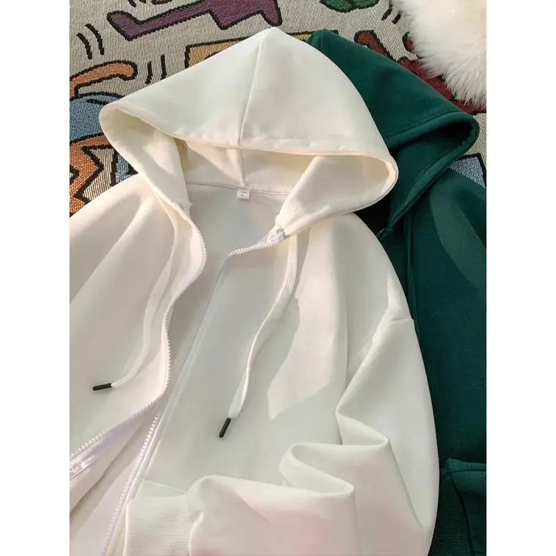 A Light Pink Solid Hooded Sweatshirt for Women in A Loose and Laid-back Style A Thin Zippered Cardigan Top for Spring and Autumn