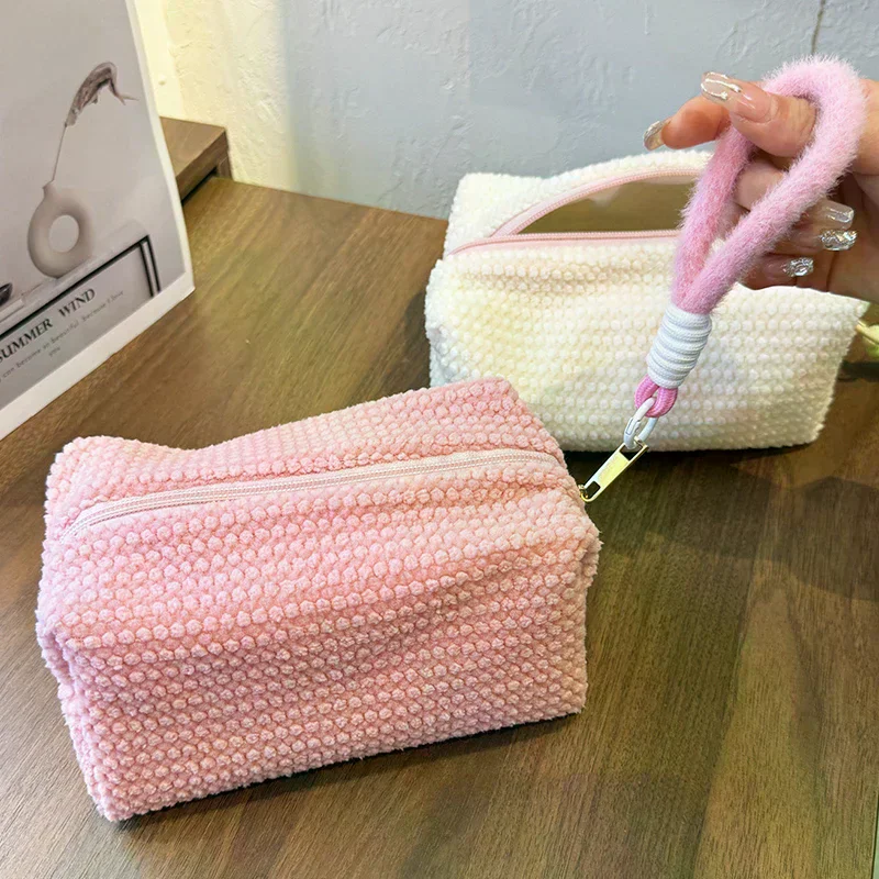 Candy colored plush large capacity makeup bag 2026 new sweet girl wash bag travel portable handheld