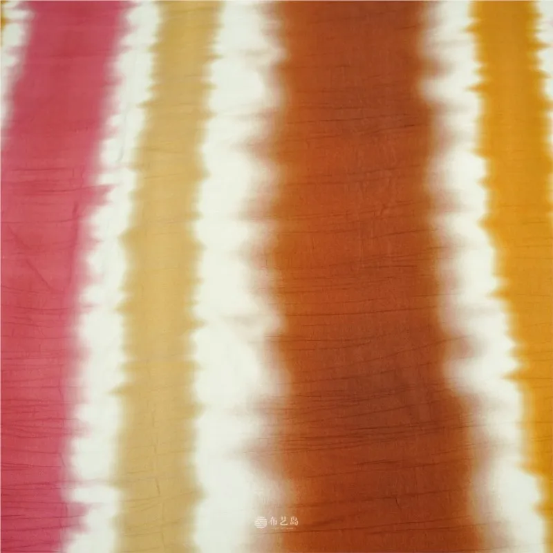 The fabric for Hanfu cheongsams features a flowing pink white brown gradient tie-dyed with horizontal stripes pleats