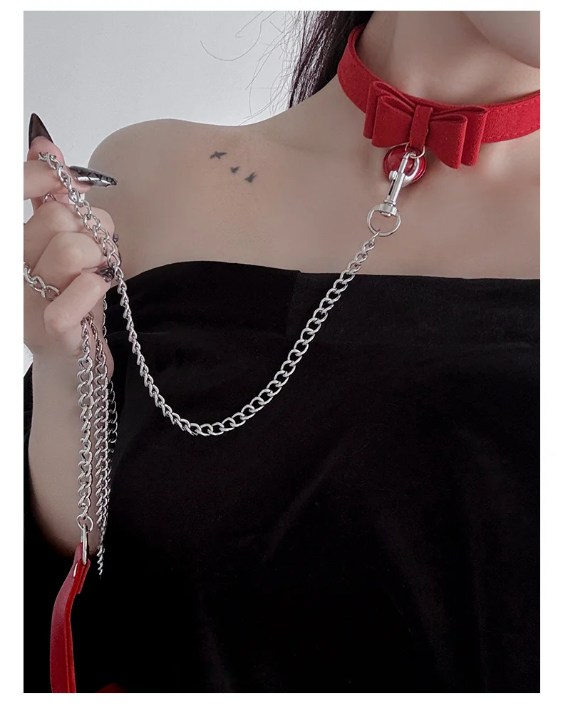

Sensory party - Role-playing Christmas woman M with a leash collar, bow, bell, neck ring (choker), and chain.