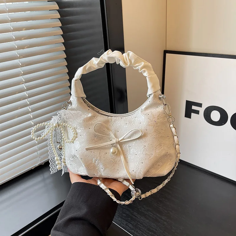 2026 New Bow Chain Handbag Fashion Niche Design Crossbody Bag Folds New Versatile Bag Tide hasr anta modeller designer bags