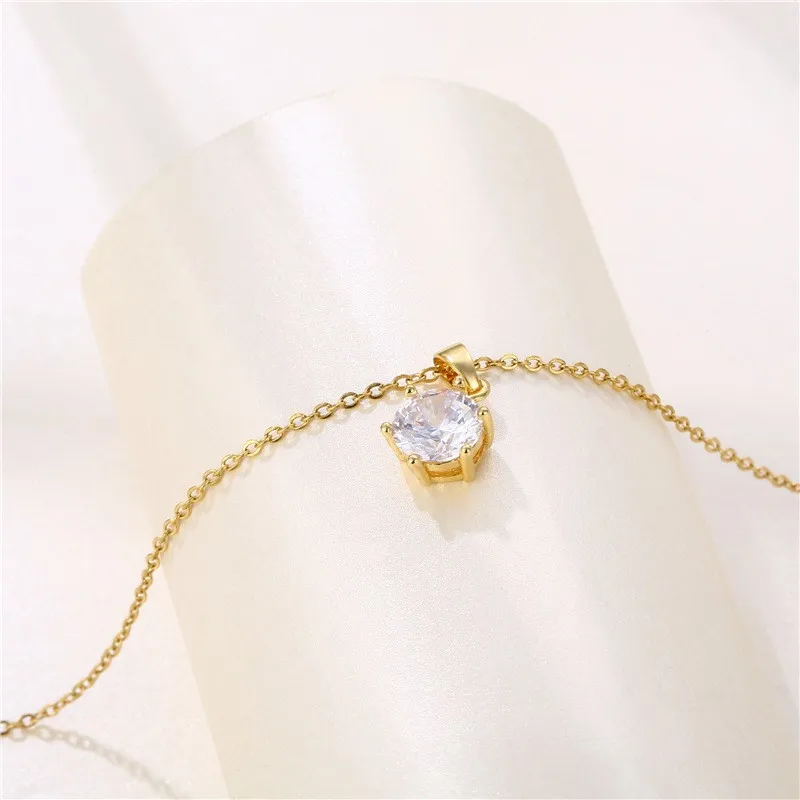 Retro-inspired alloy pendant necklace with electroplated gold finish, cross-carved floral chain, minimalist letter-shaped charm,