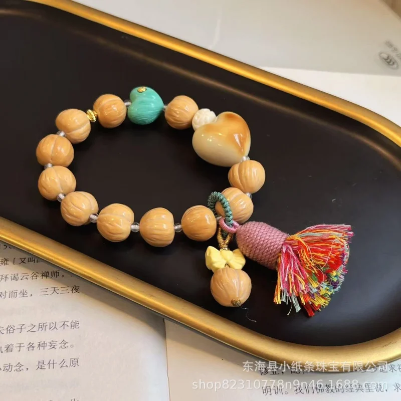 Houhoupi peach single-loop paired with ivory heart bead bracelet, a fashionable decorative piece