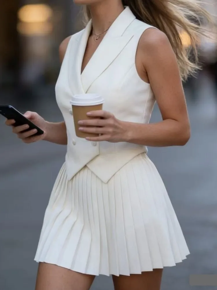 Dames nieuwe mode casual rokset lente en zomer mode revers onregelmatige mouwloze top plooirok tweedelige sets