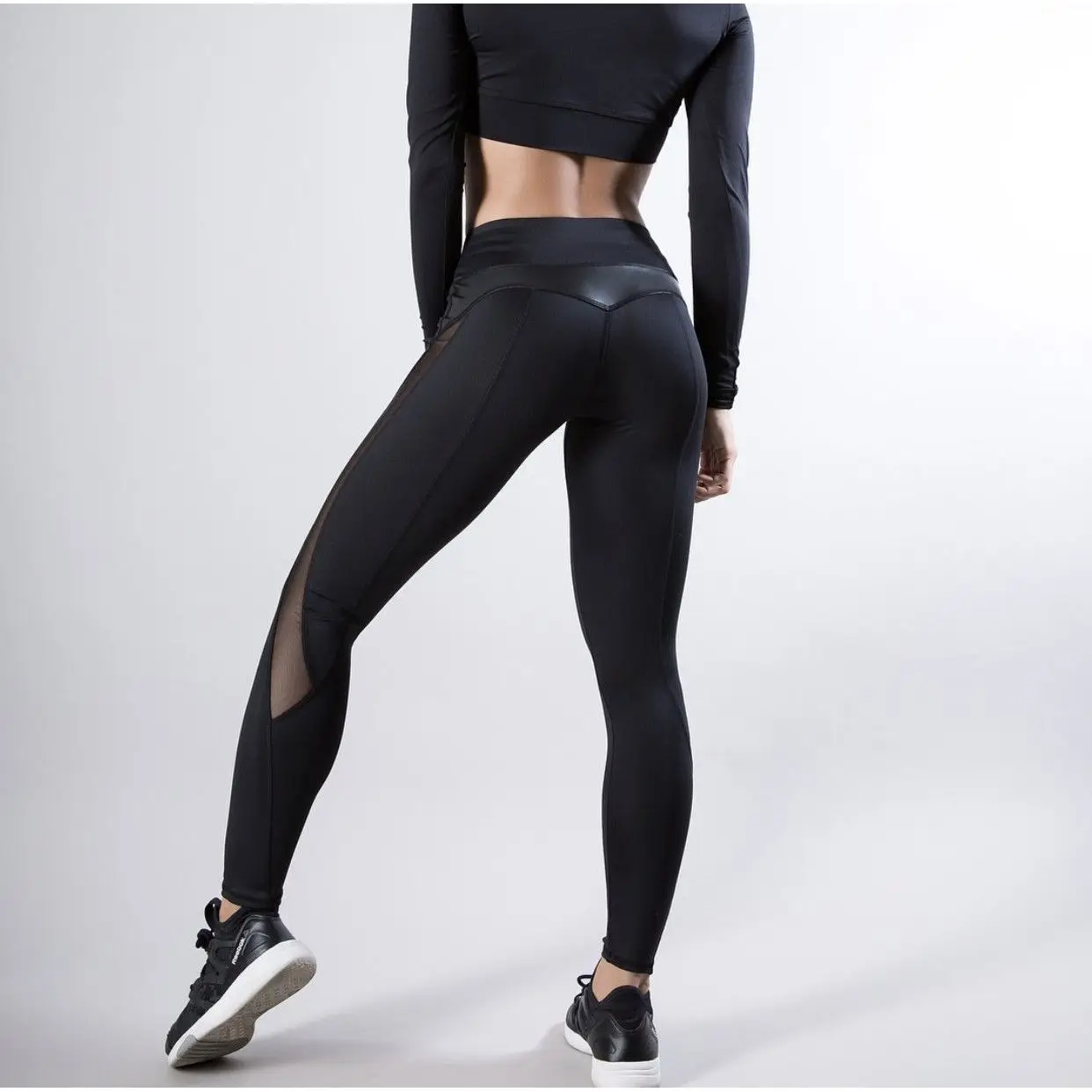 Moda de cintura alta Me PU empalme Sexy mujer Yoga deportes pantalones básicos de nueve piezas Leggings pantalones con zona para el pie fibra de poliéster