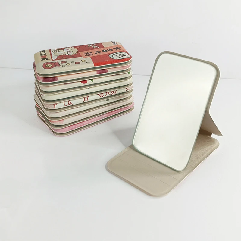 Mini espejo de bolsillo para maquillaje, herramienta de tocador de alta definición, portátil, de cuero PU, ángulo ajustable, pequeño, plegable