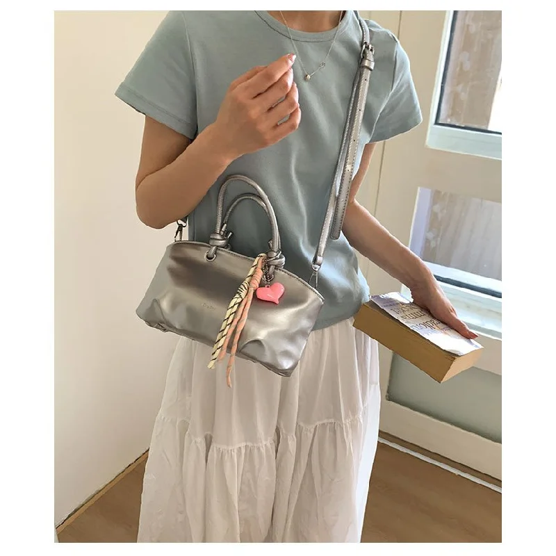 

Women's Leather Shoulder Bag Elegant And Spacious With Double Handles And Metal Accents Sophisticated Work Bag