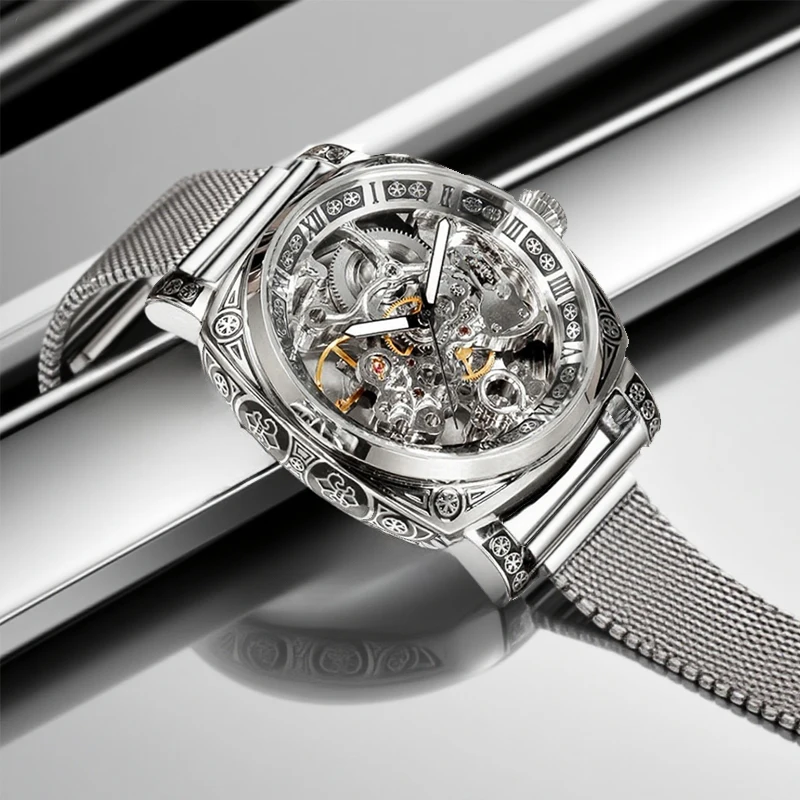 ساعة ميكانيكية أوتوماتيكية بالكامل بحزام شبكي فضي وأنيق على طراز المؤشر وأرقام رومانية للرجال.