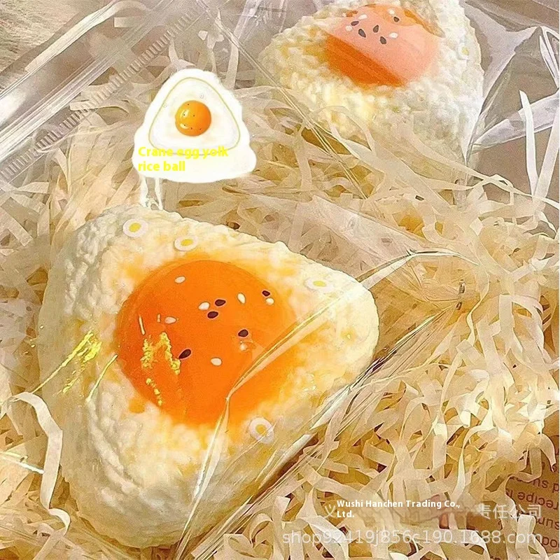 صفار البيض وكرات أرز السمسم مع نسيج هريس يخفف التوتر، ويرتد ببطء الظهر، وهي هدايا ممتعة للقرص #1