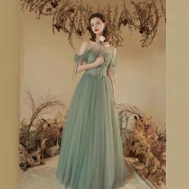 

2026 Summer New Women's Banquet Evening Dress Fashionable and Slim One Shoulder Mesh Sexy V-neck Backless Long Dress