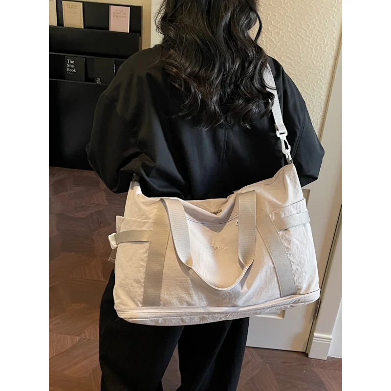 

Foldable large-capacity crossbody travel bag for women, suitable for short trips, business trips, boarding, tourism, and gym use