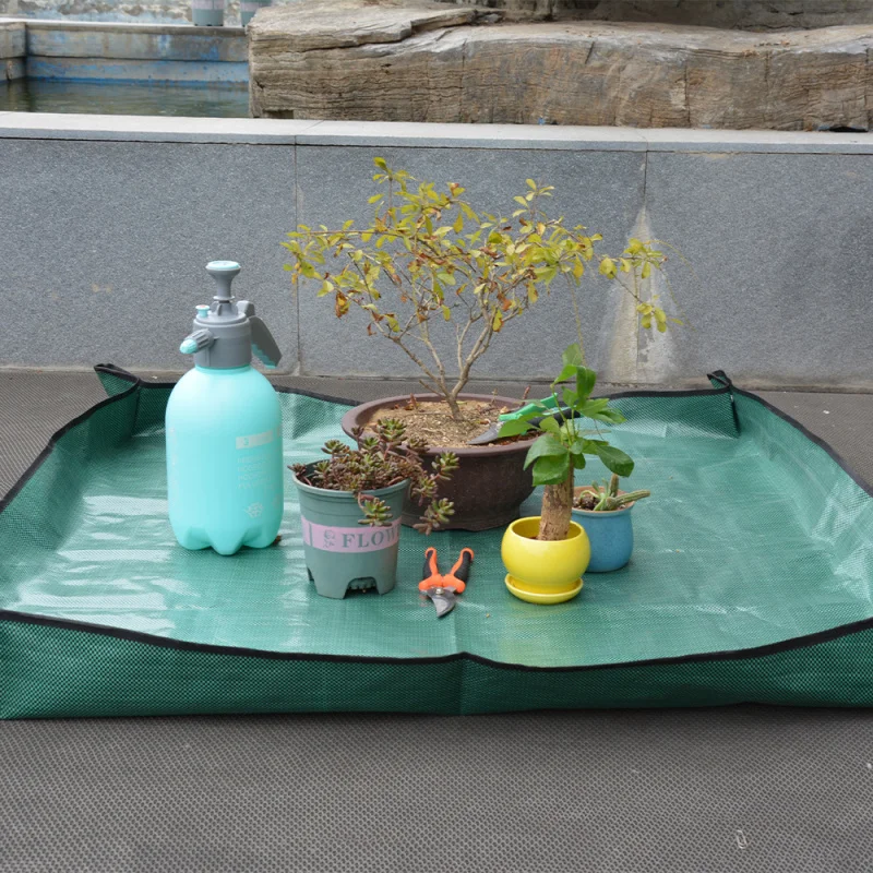 Home gardening , growing flowers and plants, and tools for changing soil and repottingPPWaterproof mat