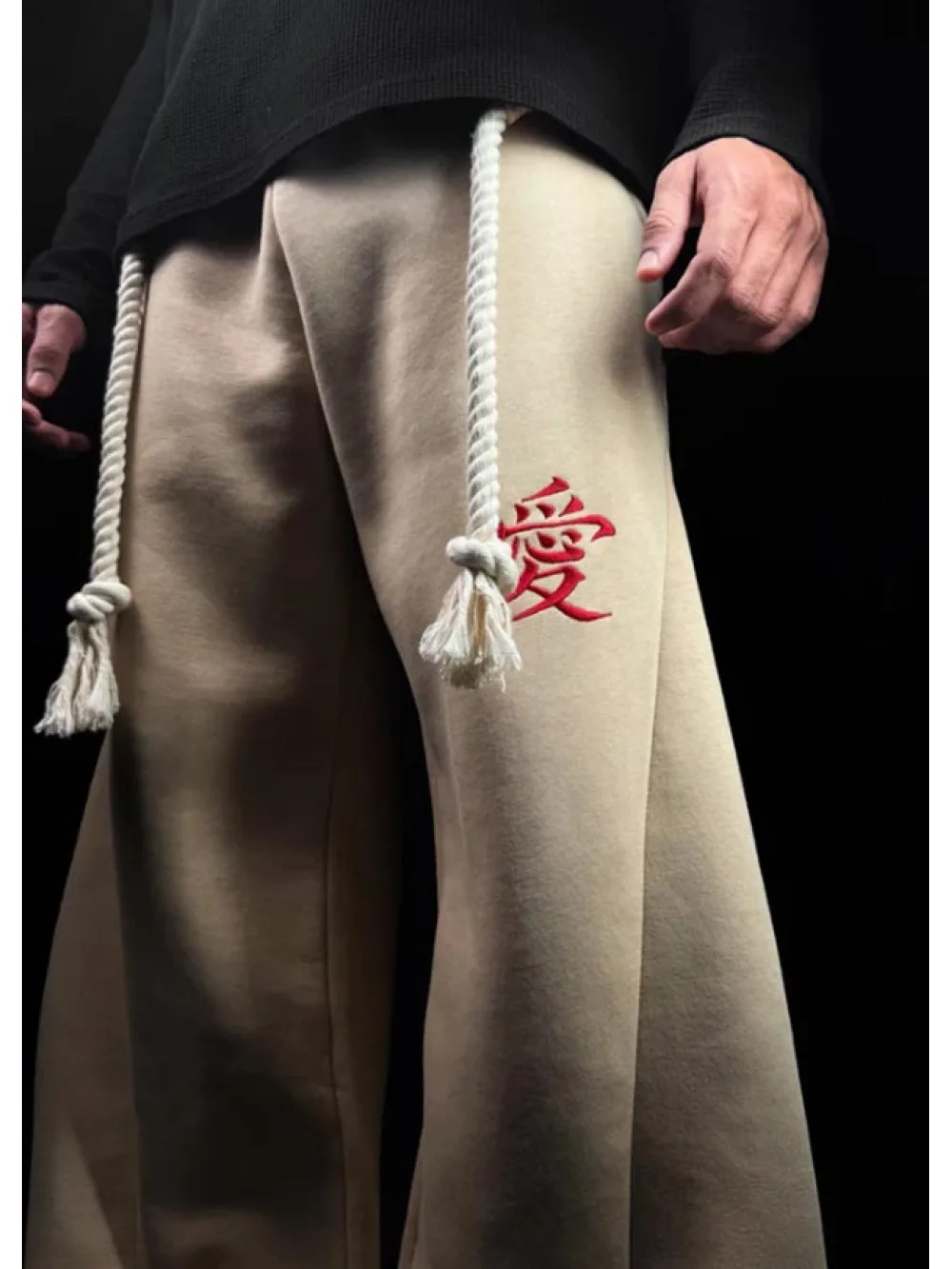 Unisex retro subculture wide leg pants with curved knife pattern and hemp rope decoration, elastic waist high street pants
