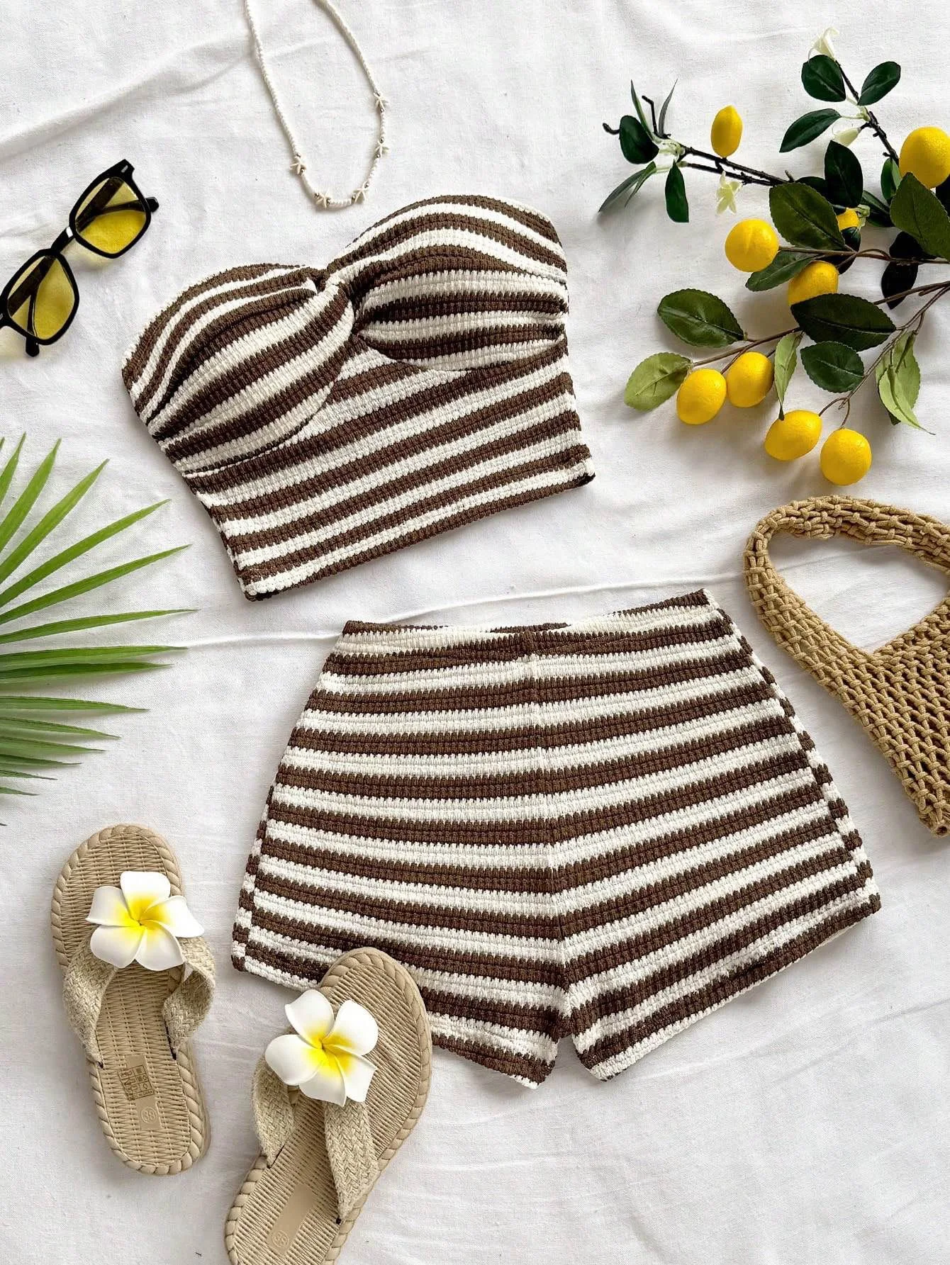 

Chic striped two-piece outfit featuring a twisted bandeau top and matching casual shorts. Perfect for beach vacations, dates, pa