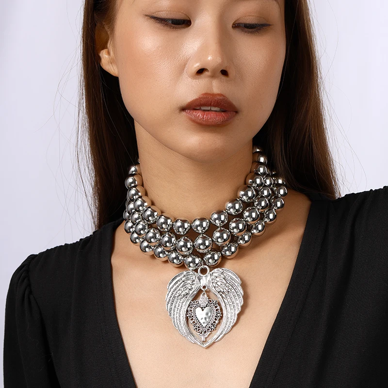 

Punk Exaggerated Handmade Beads Necklace for Women Metal Wing Heart Pendant Choker Necklace Girls Party Festival Jewelry Gifts