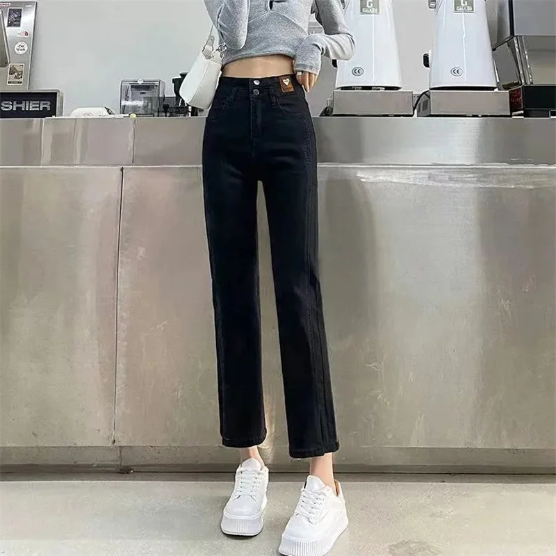 Celana Jeans Menyala Sembilan Poin Pinggang Tinggi Wanita Korea Celana Denim Forking Wanita Musim Semi Musim Gugur Celana Panjang Koboi Serbaguna Wanita 2024