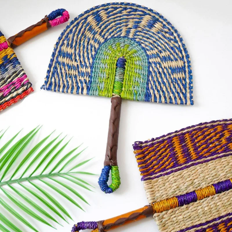 2025 New Hot-selling Seagrass Woven Straw Fan Wall Hanging African Element Wind Wall Decoration Daily Summer Hand Crank Pu