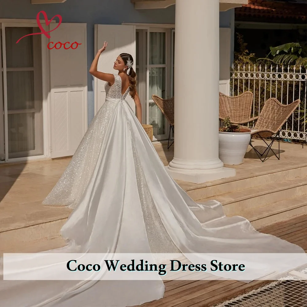 فستان زفاف فاخر مخصص من الأورجانزا مع تطريز مطرز بالخرز على شكل حرف v بدون أكمام فستان الزفاف فيستدو دي نوفيا #2