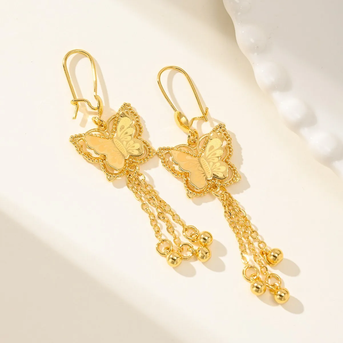 9999 gold long-style butterfly fringed bell earrings - vintage ethnic style, high-end earrings