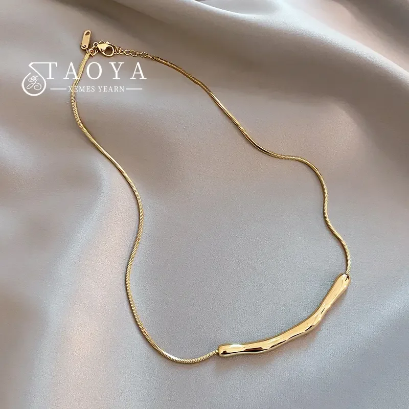 

Gold-tone stainless steel collarbone necklace designed for women with delicate chain and minimalist pendant