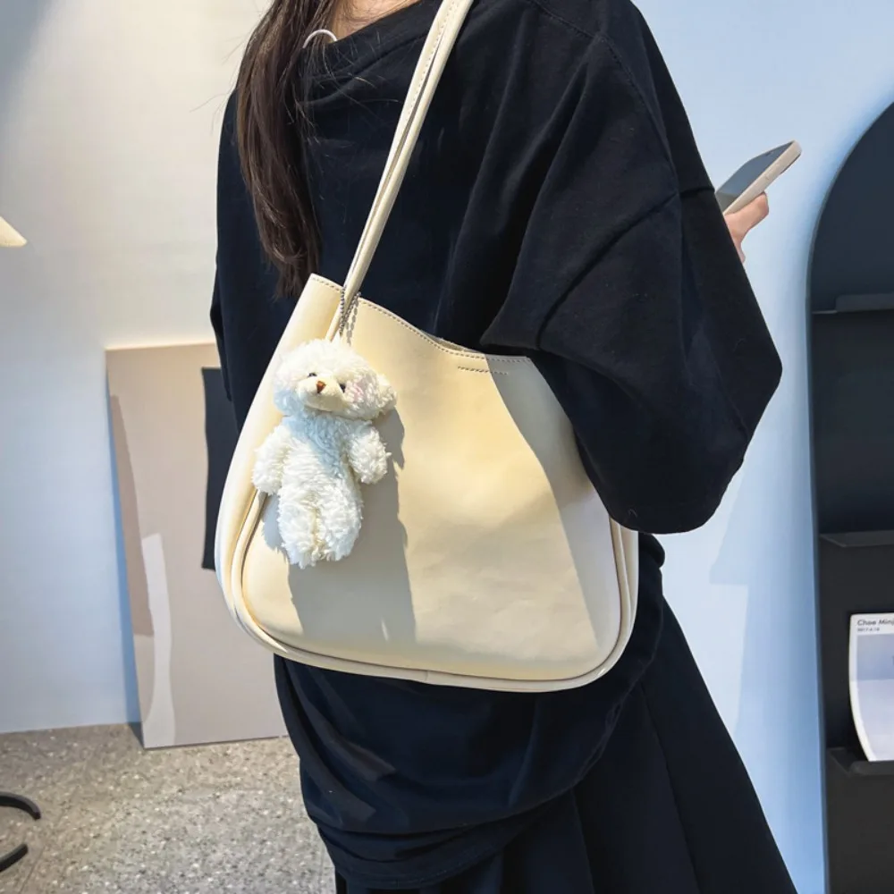 

Korean Style PU Leather Shoulder Bag Solid Color Large Capacity Underarm Bag with Bear Pendant Soft Tote Bag Casual