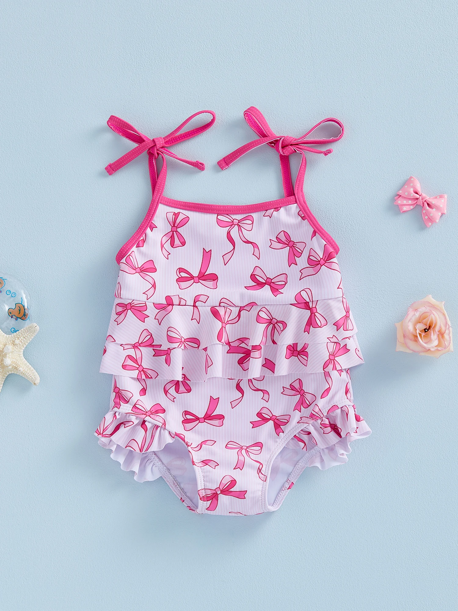 ملابس سباحة لطيفة بطبعات زهور مع حواف مكشكشة وتفاصيل فيونكة للفتيات الصغيرات - ملابس بحر للفتيات الصغيرات بدون أكمام مع