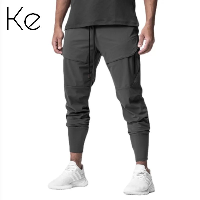 

KE033M muscles gym clothes European size men's athleisure trousers, slim little feet, fitness running training, corset trousers