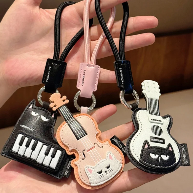Neuer Niedlicher Katzen-Gitarren-Schlüsselanhänger Cartoon Violine Klavier Katzen-Schlüsselring PU-Leder Taschenanhänger für Musikliebhaber Geschenk