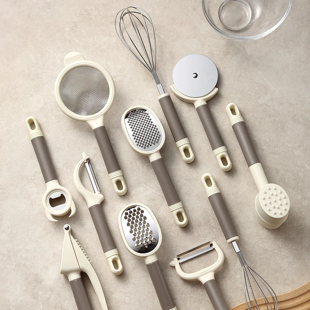 Milk-curry-toned modern kitchen set with ergonomic R-handles: flour sifter, bottle opener, garlic crusher, dual-size egg whisks,