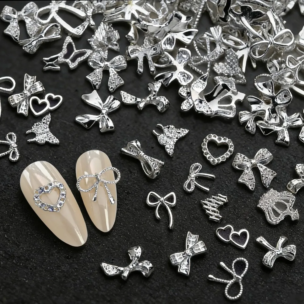ชาร์มตกแต่งเล็บรูปโบว์ผีเสื้อโลหะผสมสีเงินสีทอง 50 ชิ้น สไตล์ Y2k น่ารัก รูปโบว์ผูกผม รูปหัวใจ ของตกแต่งเล็บโลหะ โบว์ผูกผมแบบผสม อุปกรณ์ทำเล็บ