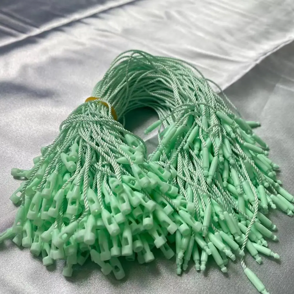 100 ชิ้น Hang Tag Strings สีขาวสีดํา Tag Fastener Hooks ผ้าฝ้าย Snap Lock Pin แท็กเสื้อผ้าเชือก DIY อุปกรณ์เย็บผ้า